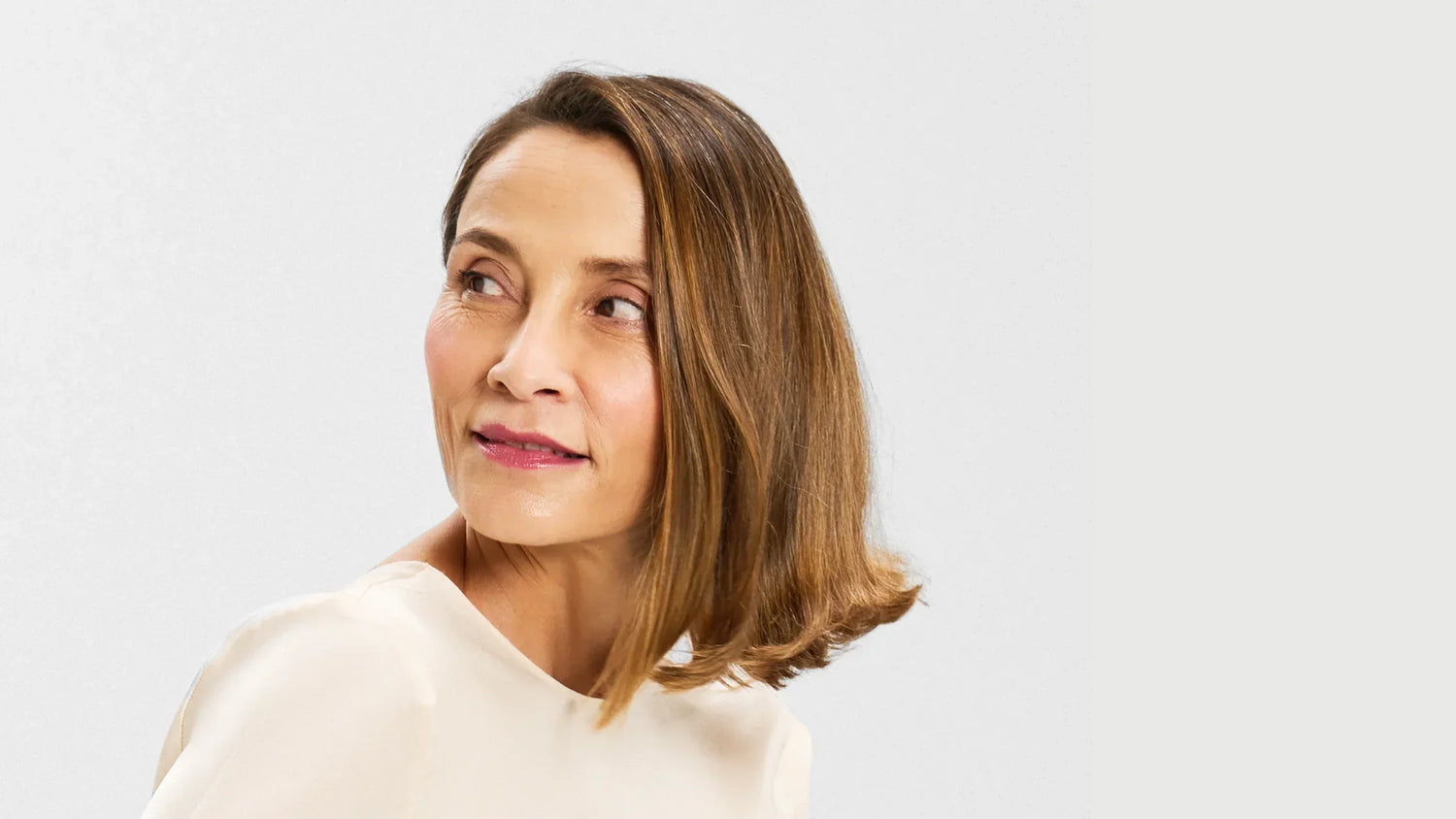 woman showing LED mask real results